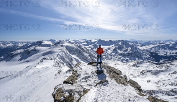 Ski tourer at the summit of Monte Cevedale, looking into the distance, mountain panorama, snow-covered mountain landscape in winter, Ortler Alps, Vinschgau Valley, Italy, Europe