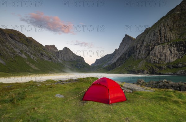 Red tent on Horseid beach, sandy beach with mountains, Lofoten, Norway, Europe