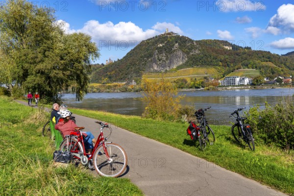 Cycle path on the Drachenfels, a mountain in the Siebengebirge on the Rhine between Bad Honnef and Königswinter, with Drachenfels castle ruins and Drachenburg castle, left, boat traffic on the Rhine, North Rhine-Westphalia, Germany, Europe