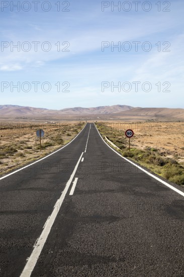 Straight tarmac road crossing desert, Fuerteventura, Canary Islands, Spain, Europe