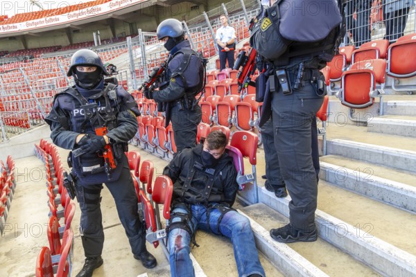 Baden-Württemberg police anti-terror exercise in the stadium. In the run-up to the European Football Championships, 1200 police officers rehearse for an emergency. Scenario: stabbing in the stands of the MHP Arena, VfB Stuttgart's stadium, which is also the venue for five European Championship matches. After initial treatment by the police, the handover of the injured to the emergency services and fire brigade was also rehearsed. Stuttgart, Baden-Württemberg, Germany, Europe