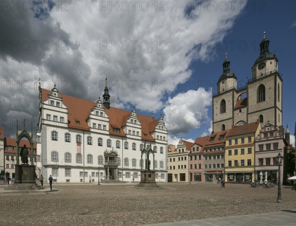 Luther city Wittenberg Market Square 6369 left Town Hall 16th century right Towers of the town church 13th-16th century on the square Monuments to Melanchton and Luther 19th century