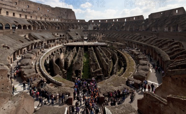 Interior with wall remains below the former arena, general view from north-west