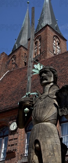 General view en face in front of the arcade wing of the town hall, built in 1525 Copy 1974 m wooden (!) pointing sword above Marienkirche towers height 7.80 m