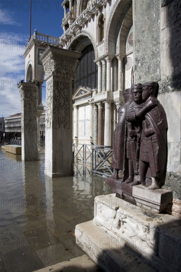 Late antique porphyry statues of the four tetrarchs in front of the western south façade with flooded St Mark's Square (slight flooding), St, Saint, Saint