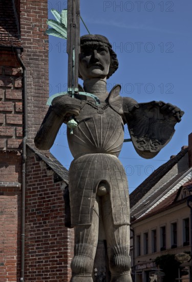 General view en face in front of the arcade wing of the town hall, built in 1525, copy 1974 with wooden (!) pointing sword, height 7.80 metres