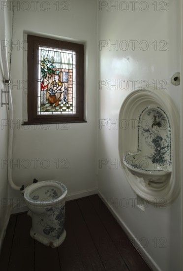 Manufacturer's villa, toilet halfway up the stairs, stained glass window with blacksmith depiction