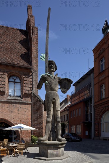 General view en face in front of the arcade wing of the town hall, built in 1525, copy 1974 with wooden (!) pointing sword, height 7.80 metres