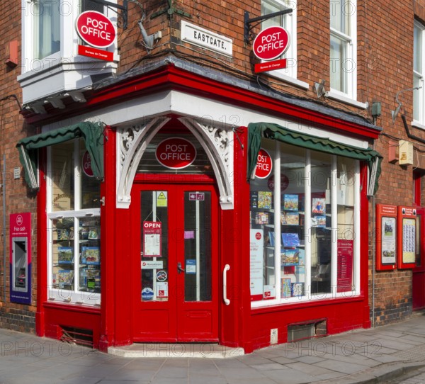 Post Office corner shop painted bright red, Eastgate, Bailgate, Uphill area of city of Lincoln, Lincolnshire, England, UK