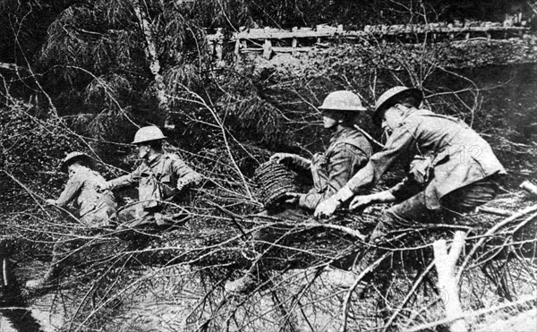 World War I. Canadians stretching barbed wire on the Somme front