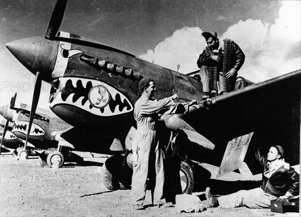 U.S crew checks over P-40