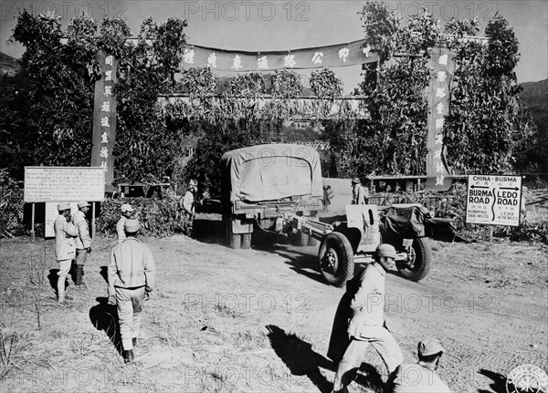 Convoy crosses China border under garland arch at Wanting (January 28, 1945)