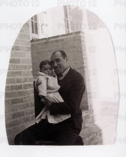 Farah Diba in the arms of her father