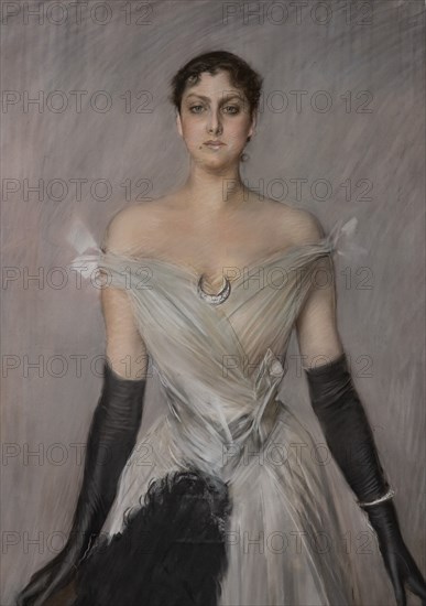 “Portrait of a lady in white with gloves and fan” by Giovanni Boldini