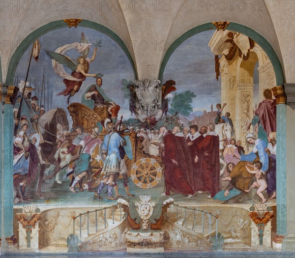 Medici Villa La Petraia, courtyard: “Triumphal entry of Cosimo I into Siena”, fresco from the cycle of the Fasti Medicei by Volterrano (Baldassarre Franceschini), 1636-1647.
In 1555 Cosimo I de' Medici conquered Siena with the help of the Imperials, a military feat which later earned him the title of Grand Duke, therefore a crucial moment for the Medici house. The fresco, with clear celebratory intentions, shows Cosimo making his triumphal entry into the city gates on a golden chariot, followed by a large group of dignitaries, welcomed by the Sienese senators and some citizens. Above, a winged Victory crowns him with a laurel wreath.
Villa medicea La Petraia, Firenze (FI) - Florence, Toscana - Tuscany, Italia - Italy