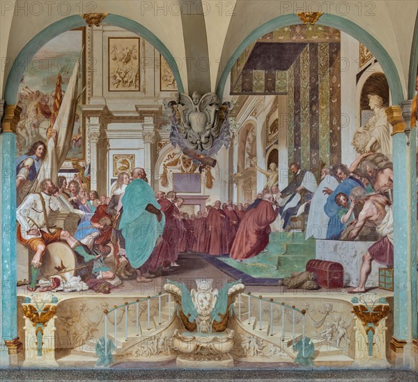 Medici Villa La Petraia, courtyard: “Cosimo I associates his son Francesco with the government”, fresco from the cycle of the Fasti Medicei by Volterrano (Baldassarre Franceschini), 1636-1647.
Set in the Salone dei Cinquecento in Palazzo Vecchio, the scene shows Cosimo I extending the nomination that associates him with the government to his son Francesco on the throne. Francis then receives homage from the Florentine senators, among a varied crowd of onlookers. On the wall you can see the Festina lente tortoise, Cosimo's emblem and, anachronistically, the rhinoceros, which will be the emblem of Cosimo's other son, Ferdinando I. The statues of Peace and Abundance, on the sides of the throne, represent a good omen about the new government, close to court officials pouring bags of coins into a chest. On the left you can see a warrior in the foreground, sitting with a dreamy expression on a broken war drum, because he will no longer have to play it.
Villa medicea La Petraia, Firenze (FI...