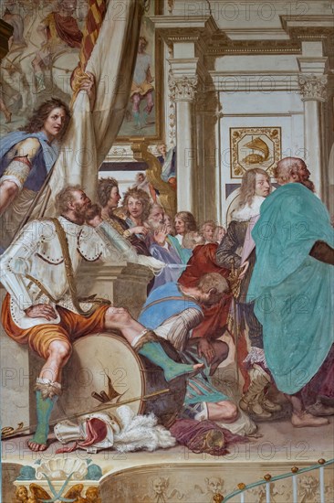 Medici Villa La Petraia, courtyard: “Cosimo I associates his son Francesco with the government”, fresco from the cycle of the Fasti Medicei by Volterrano (Baldassarre Franceschini), 1636-1647.
Set in the Salone dei Cinquecento in Palazzo Vecchio, the scene shows Cosimo I extending the nomination that associates him with the government to his son Francesco on the throne. Francis then receives homage from the Florentine senators, among a varied crowd of onlookers. On the wall you can see the Festina lente tortoise, Cosimo's emblem and, anachronistically, the rhinoceros, which will be the emblem of Cosimo's other son, Ferdinando I. The statues of Peace and Abundance, on the sides of the throne, represent a good omen about the new government, close to court officials pouring bags of coins into a chest. On the left you can see a warrior in the foreground, sitting with a dreamy expression on a broken war drum, because he will no longer have to play it.
Villa medicea La Petraia, Firenze (FI...