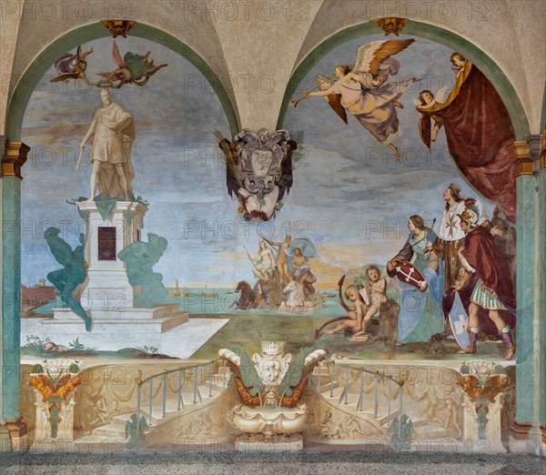 Medici Villa La Petraia, courtyard:“Dominance of Tuscany over the sea”, fresco from the cycle of the Fasti Medicei by Volterrano (Baldassarre Franceschini), 1636-1647.
The scene is set in Livorno, the Medici port and ideal city refounded by Francesco I de' Medici and his brother Ferdinand I, in the shadow of the monument of the Four Moors, with the statue of Ferdinand crowned by two winged victories. In the centre, in the background, Neptune's chariot proceeds, with Galatea and Perseus (holding Medusa's shield), to which the sea god points the statue. They sail among a large group of galleys of the Order of Saint Stephen.
On the right, in front of a cloth held up by putti in the face and under a personification of Fame, we see the allegories of Tuscany (with the crossed shield), of the Grand Duchy (with crown, scepter and mantle with the crest of the Order) and of Livorno, with the castle coat of arms.
Villa medicea La Petraia, Firenze (FI) - Florence, Toscana - Tuscany, Italia - It...