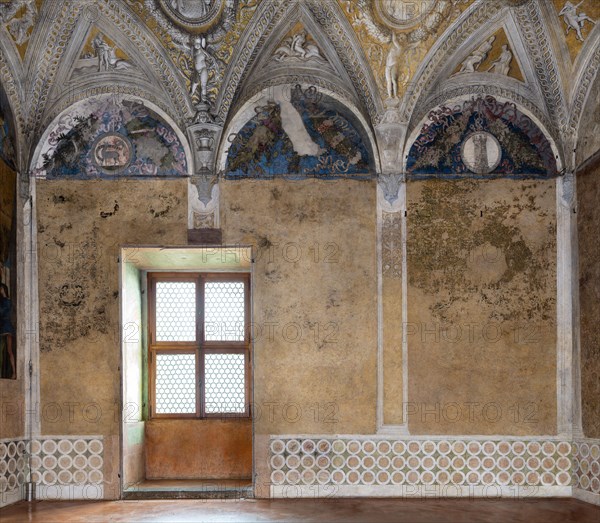 Ducal Palace: north-east wall of the “Bridal Chamber or Camera Picta", is a room located in the north-east tower of the Castle of San Giorgio in Mantua. It is famous for the cycle of frescoes that covers its walls, a masterpiece by Andrea Mantegna, created between 1465 and 1474. The general theme is a political-dynastic celebration of the entire family of Ludovico II Gonzaga, with the occasion of the election of his son Francesco as cardinal.
The wall has three beautiful lunettes with festoons and heraldic devices.
Palazzo Ducale, Mantova (MN) - Mantua, Lombardia - Lombardy, Italia - Italy