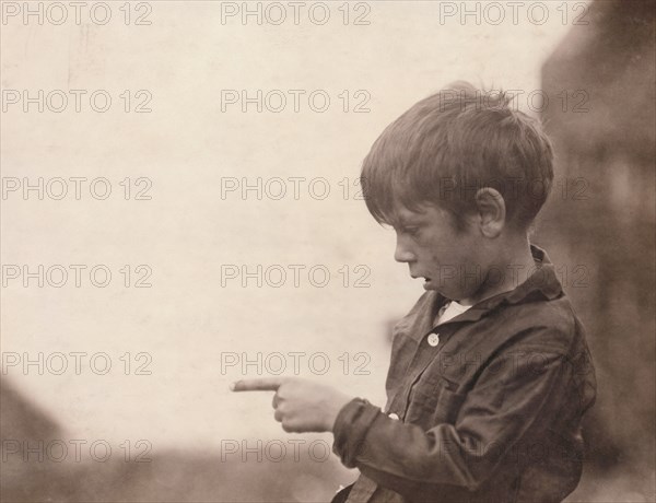 7-year-old Boy with Injured Finger while Cutting Sardines at Cannery, Eastport, Maine, USA, Lewis Hine, 1911