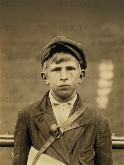 Barney Goldstein, 10-year-old Newsboy, Works 5 hours per day and Visits Saloons, Half-Length Portrait, Wilmington, Delaware, USA, Lewis Hine for National Child Labor Committee, May 1910