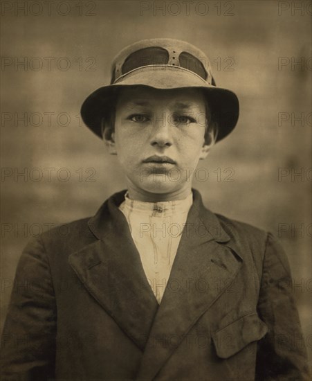 William Gross, 15-year-old Newsboy, has been selling Newspapers for 5 years, Average Earnings 50 cents per week, also Guides Men to Houses of Prostitution, Half-length Portrait, Wilmington, Delaware, USA, Lewis Hine for National Child Labor Committee, May 1910