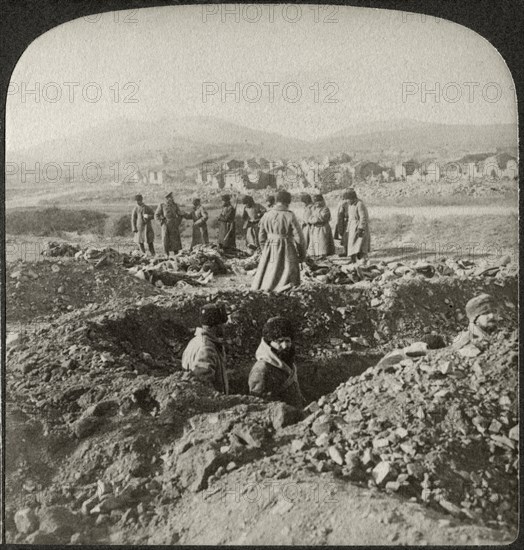 Burying the Russians killed in the desperate fighting on 203 Metre Hill in Besieged Port Arthur, Single Image of Stereo Card, Underwood & Underwood, 1905