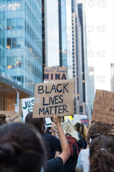 Protester holding up Black Lives Matter Sign during Juneteenth March, Midtown,