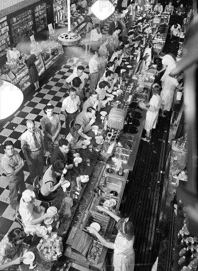 High angle view of lunchtime crowd at noon, People's Drugstore, G Street N.W., Washington, D.C., USA, Marjory Collins, U.S. Office of War Information, July 1942