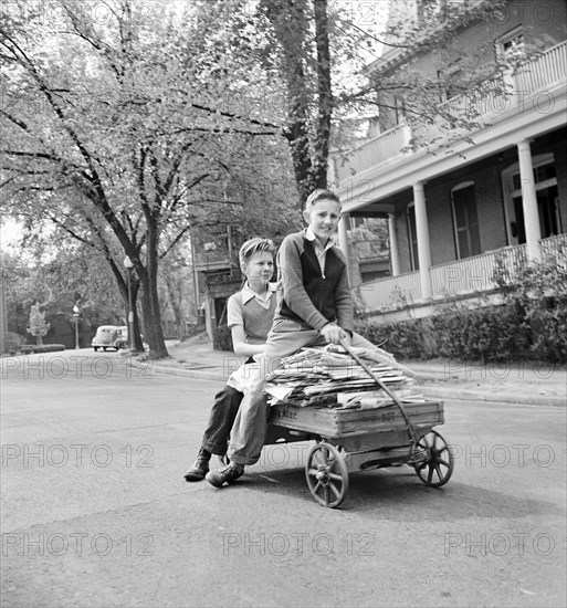 Schoolboy volunteers collecting scrap paper during Victory Program Salvage Drive, Washington, D.C., USA, Marjory Collins, U.S. Office of War Information, May 1942