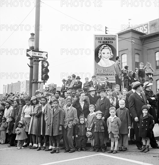 Crowd on street corner watching Armistice Day parade, Lancaster, Pennsylvania, USA, Marjory Collins, U.S. Office of War Information, November 1942