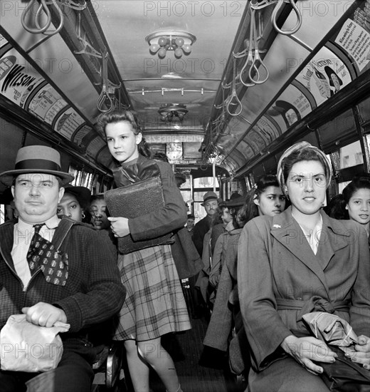 School children and workers returning home on a trolley at five p.m., Baltimore, Maryland, USA, Marjory Collins, U.S. Office of War Information, April 1943