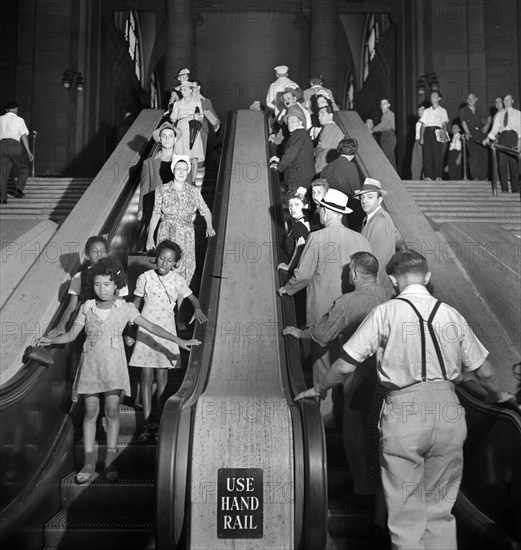 Group of people on escalators, Pennsylvania Station, New York City, New York, USA, Marjory Collins, U.S. Office of War Information, August 1942