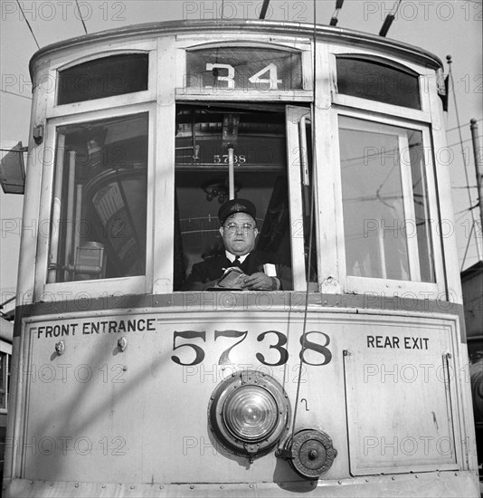 1917 vintage trolley, reconditioned because of wartime transportation pressure, and motorman, Baltimore, Maryland, USA, Marjory Collins, U.S. Office of War Information, April 1943