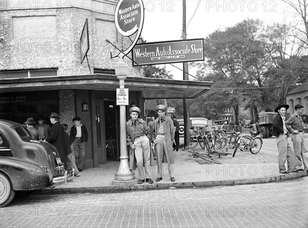 Two soldiers standing on street corner in Starke, Florida, USA, Marion Post Wolcott, U.S. Farm Security Administration, December 1940