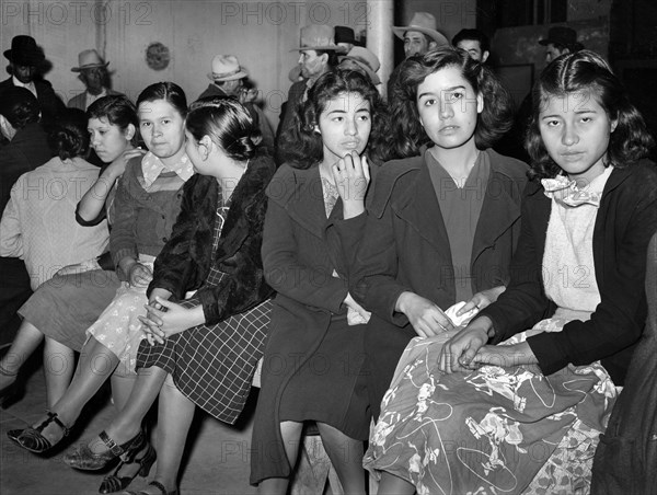 Mexican pecan workers waiting in union hall for assignment to work. San Antonio, Texas, USA, Russell Lee, U.S. Farm Security Administration, March 1939