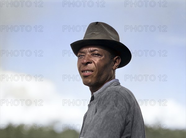 Agricultural worker on Allen Plantation, operated by Natchitoches farmstead association, a cooperative established through the cooperation of FSA (Farm Security Administration), Natchitoches, Louisiana, USA, Marjory Collins, U.S. Office of War Information, May 1940