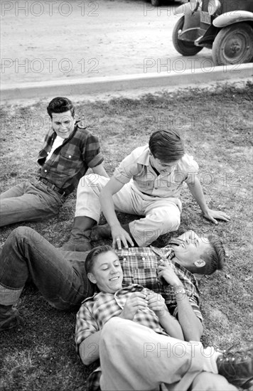 Group of young men relaxing on lawn, Imperial County Fair, El Centro, California, USA, Russell Lee, U.S. Farm Security Administration, March 1942