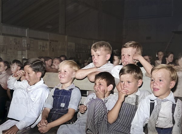 Children watching their schoolmates in program at end of school term, FSA (Farm Security Administration) labor camp, Caldwell, Idaho, USA, Russell Lee, U.S. Farm Security Administration, June 1941