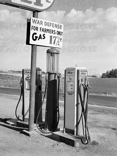 Gas station pump with sign that reads "War Defense For Farmers Only Gas 17 1/2 ¢", Twin Falls County, Idaho, USA, Russell Lee, U.S. Farm Security Administration, July 1942