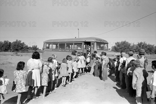 Children of migratory laborers who are living at migratory labor camp boarding school bus, Agua Fria, Arizona, USA, Russell Lee, U.S. Farm Security Administration, March 1940