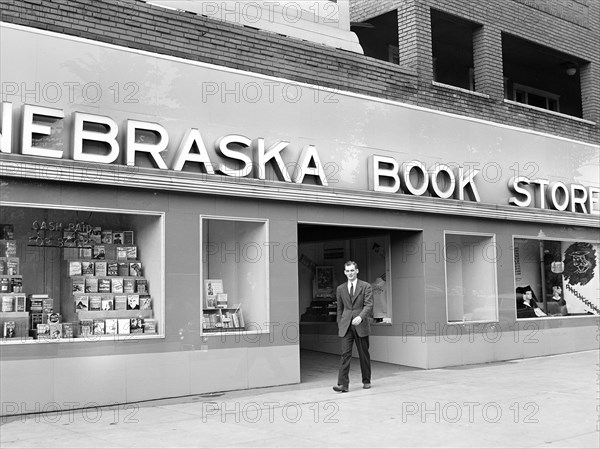 John Cockle walking out of campus bookstore, University of Nebraska, Lincoln, Nebraska, USA, John Vachon, U.S. Office of War Information, May 1942