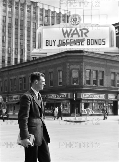 John Cockle on downtown street corner, Lincoln, Nebraska, USA, John Vachon, U.S. Office of War Information, May 1942