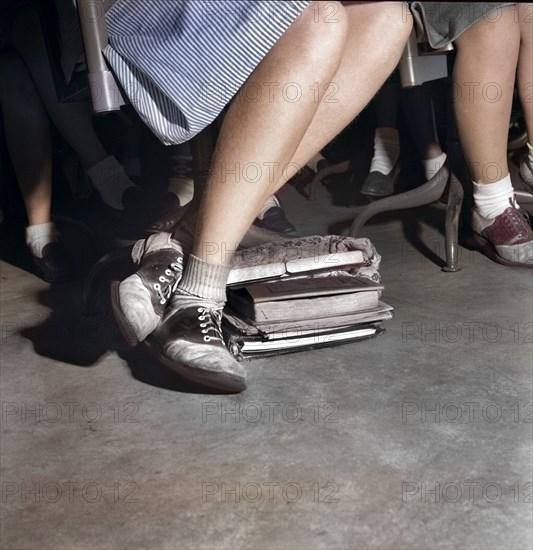 Feet of students sitting in classroom, Woodrow Wilson High School, Washington, D.C., USA, Esther Bubley, U.S. Office of War Information,  October 1943