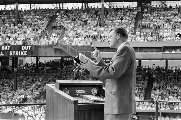 Evangelist Billy Graham preaching to crowd at crusade, Griffith Stadium, Washington, D.C., USA, John T. Bledsoe, U.S. News & World Report Magazine Photograph Collection, June 25, 1960