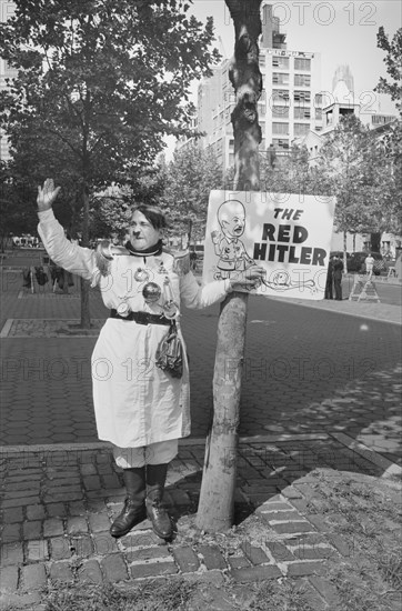 Man dressed as Adolf Hitler with sign reading "The Red Hitler," protesting the visit of Soviet Premier Nikita Khrushchev, near the United Nations building, New York City, New York, USA, Marion S. Trikosko, U.S. News & World Report Magazine Photograph Collection, September 21, 1960