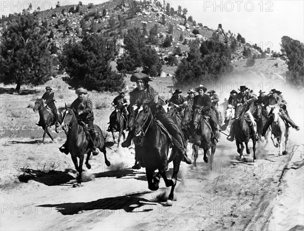 Max Baer (center), on-set of the film, "Buckskin Frontier", United Artists, 1943