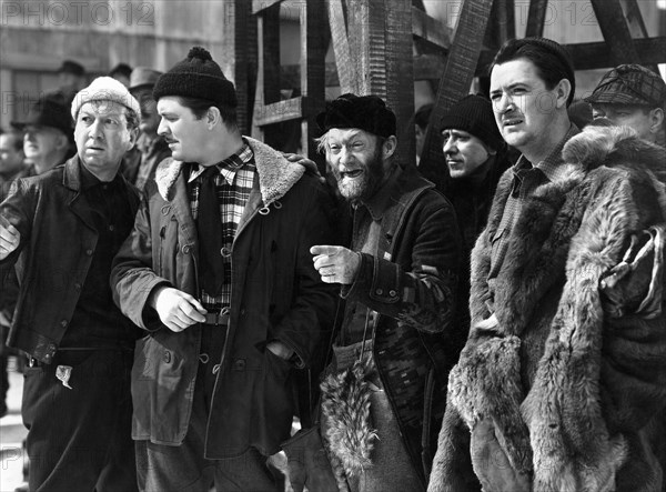 Lyle Talbot (2nd left), Al St. John (center), Charles Anthony Hughes (right), on-set of the film, "Call Of The Yukon", Republic Pictures, 1938