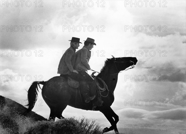 Two cowboys on horseback, on-set of the film, "Butch Cassidy And The Sundance Kid", 20th Century-Fox, 1969