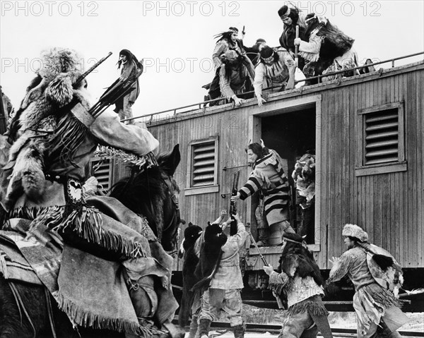 Native American bandits robbing weapons from train, on-set of the film, "Breakheart Pass", United Artists, 1976